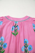 Back view of Coastal Kiss Dress in magenta with floral print and striped detail, perfect for sunny days.