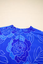 Close-up of the Blue Crush Dress neckline featuring floral print and ruffled detail.