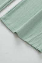 Minty jade green textured fabric of the FULLY JADED SET lounge wear, offering luxurious comfort and style in polyester and elastane.