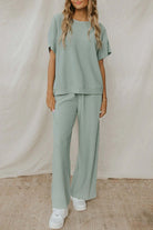 Woman wearing Fully Jaded Set in minty jade green, featuring textured design, elegant lounge wear by [Brand Name], polyester-elastane blend.