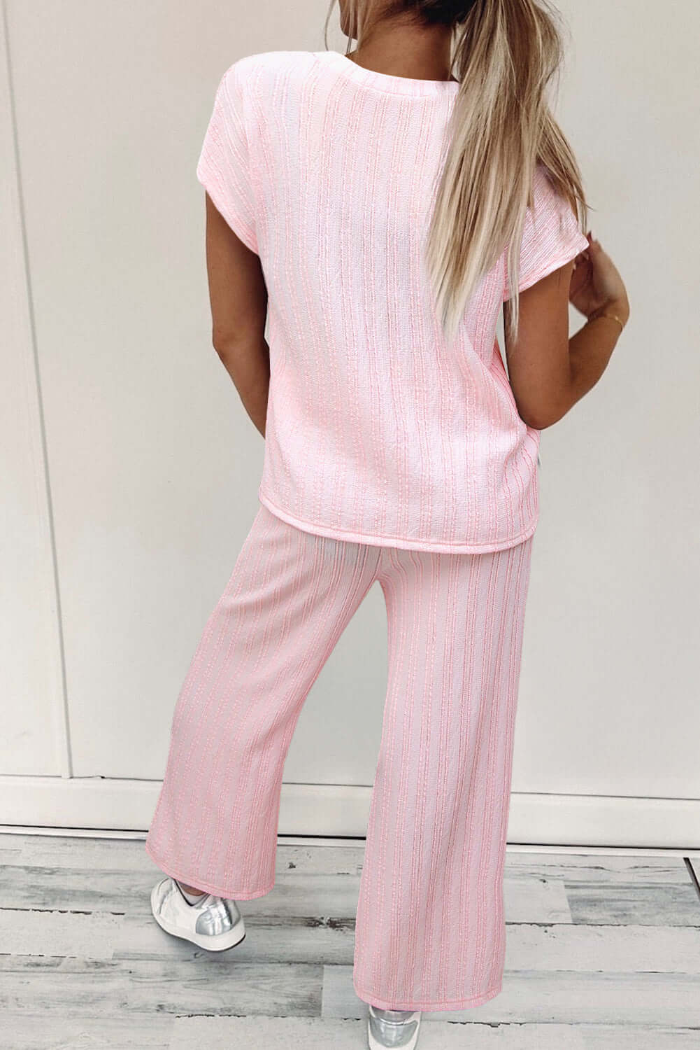 Dreamy light pink Soft Serenade Set featuring a textured Henley top and wide-leg pants for a chic, comfy look.