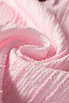 Close-up of soft pink textured fabric, perfect for a stylish outfit like the Soft Serenade Set.