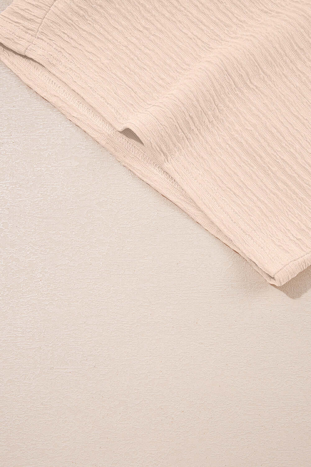 Textured pink fabric detail of the Champagne Chill 2 Piece Set showcasing softness and stylish design.