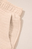 Close-up of textured beige shorts with elastic waistband from the Champagne Chill 2 Piece Set.