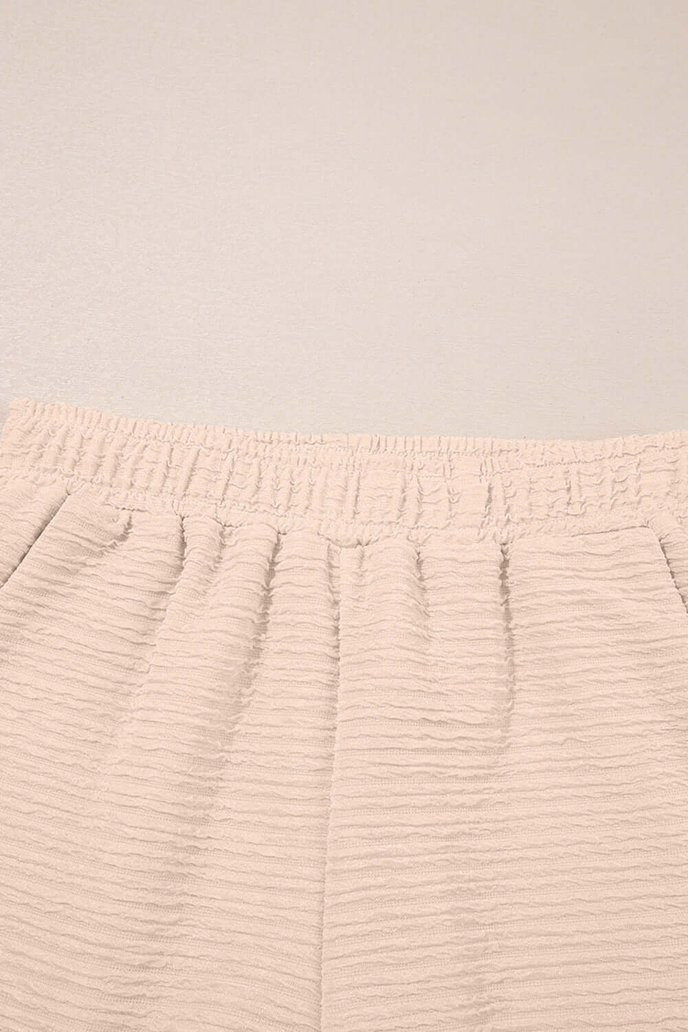 Elastic waistband of textured pink shorts from the Champagne Chill 2 Piece Set, perfect for casual lounging.