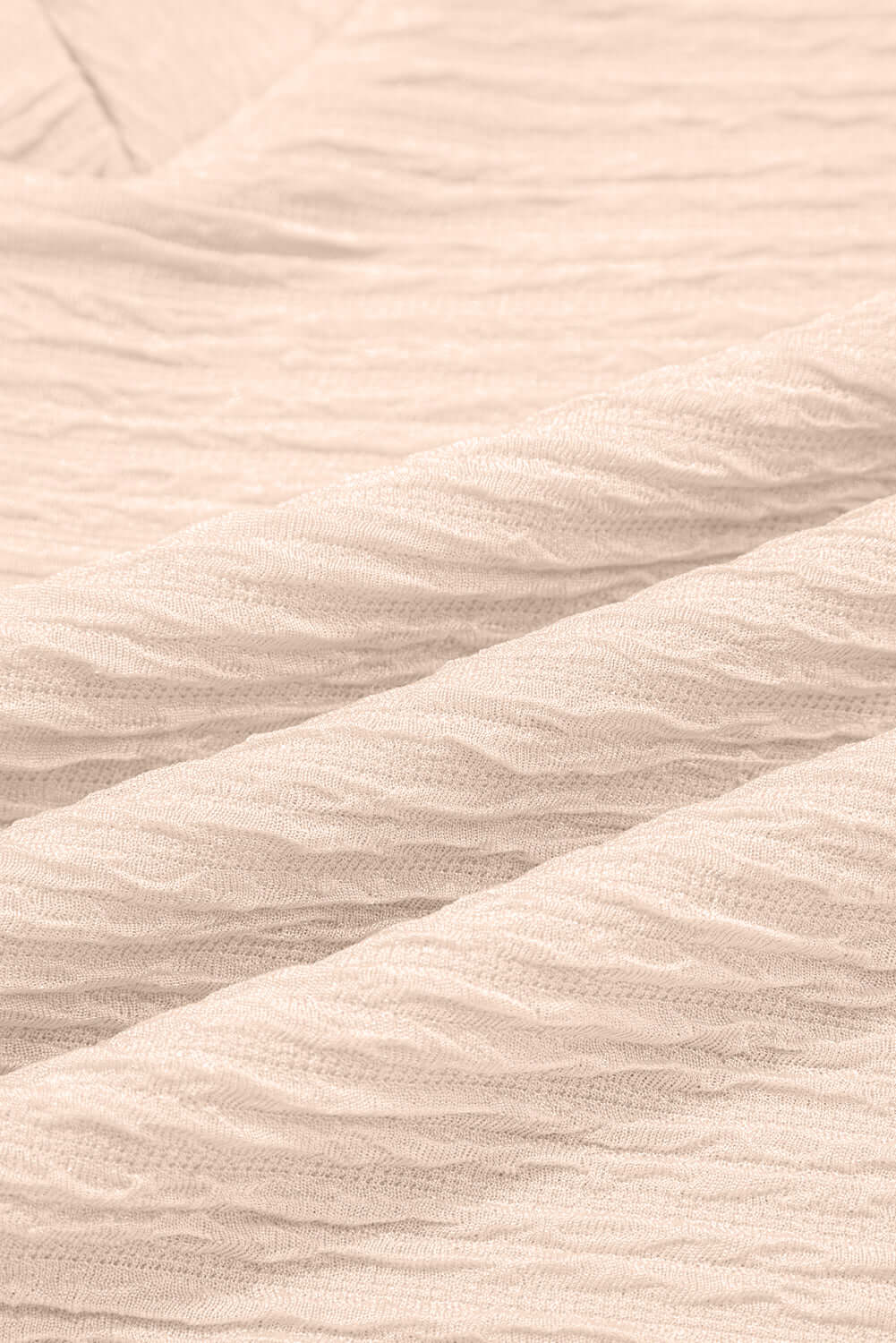Textured pink fabric close-up showcasing the soft, cozy feel perfect for the Champagne Chill two-piece set.