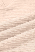 Textured pink fabric close-up showcasing the soft, cozy feel perfect for the Champagne Chill two-piece set.