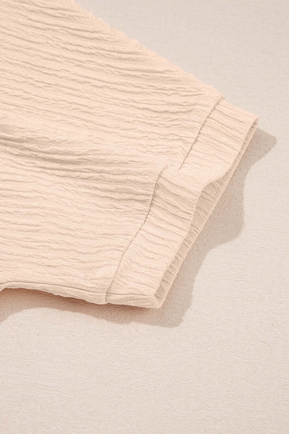 Close-up of textured pink fabric from the CHAMPAGNE CHILL 2 PIECE SET, showcasing soft, cozy material.