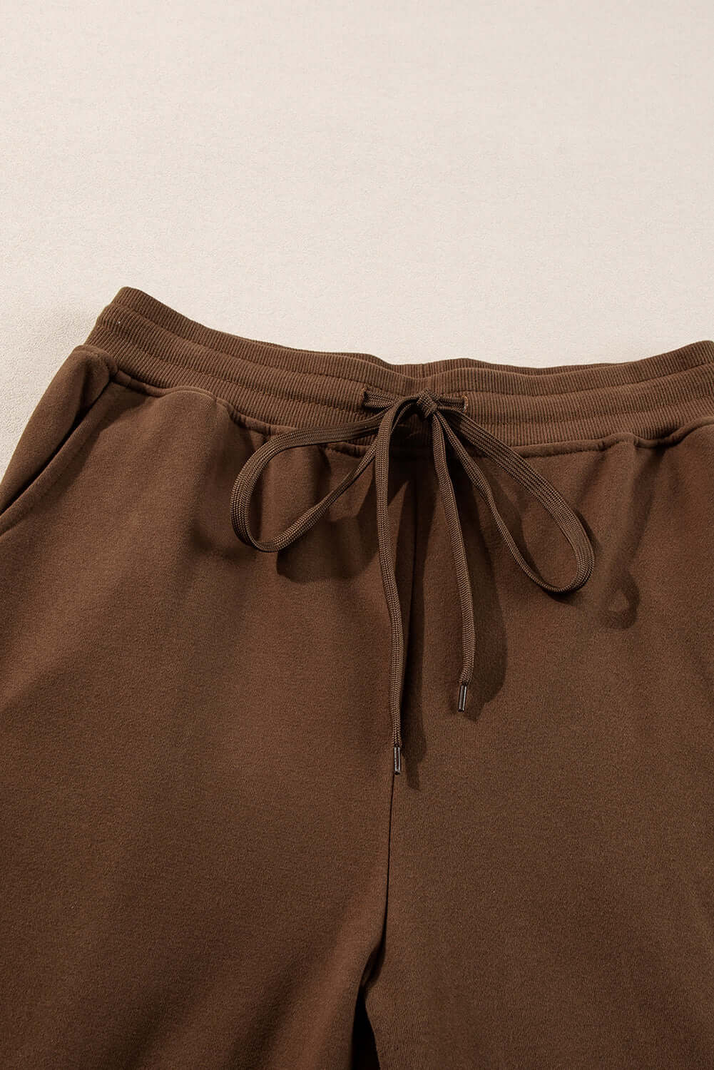 Cozy cocoa lounge pants featuring a drawstring waist and relaxed fit for ultimate comfort.