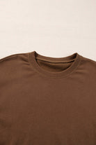 Close-up of cozy cocoa crew neck pullover from the Elemental Energy Set, featuring a relaxed fit and soft fabric.