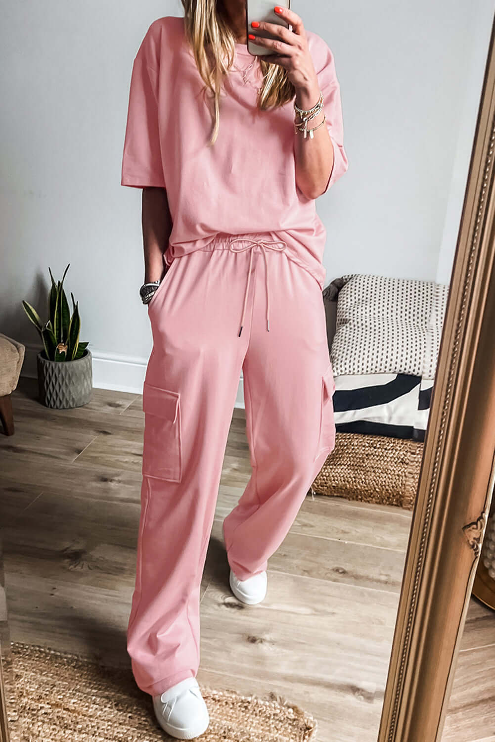 Cozy pink lounge set with half sleeve tee and cargo sweatpants, perfect for casual outings or lounging at home.