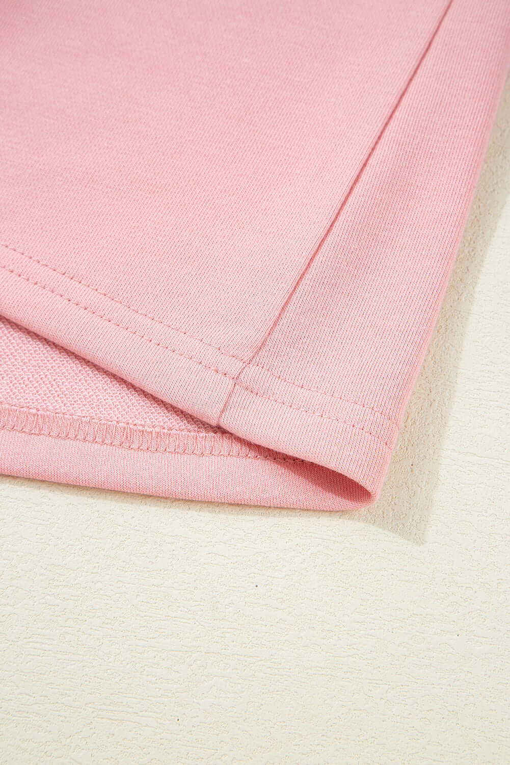 Close-up of the soft fabric and stitching details of the Pink Cloud lounge set half sleeve tee.