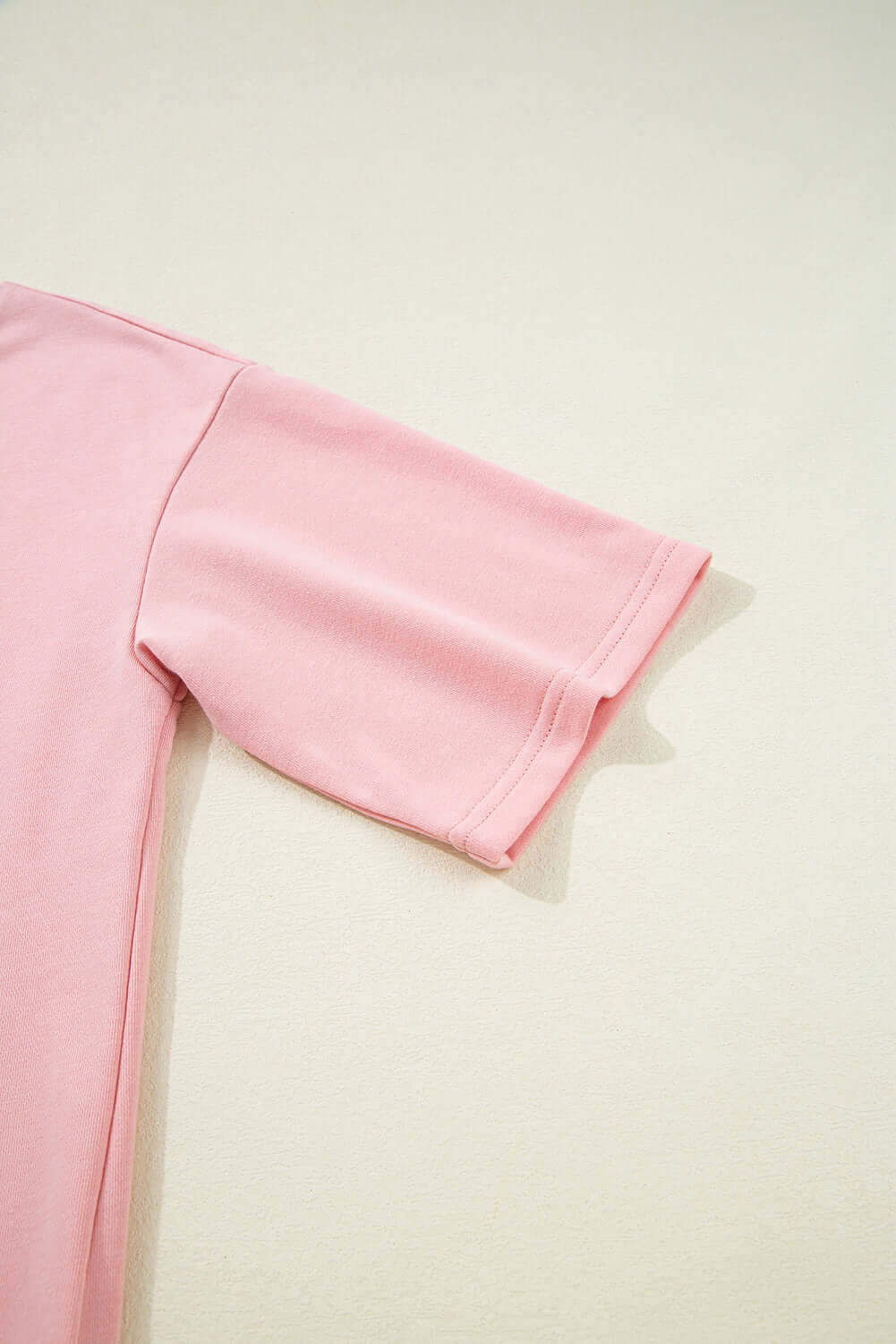 Close-up of half sleeve pink t-shirt from the Pink Cloud lounge set, showcasing soft fabric and casual style.