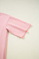 Close-up of the stylish half sleeve tee from the Pink Cloud lounge set, showcasing its soft pink fabric.