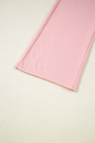 Close-up of the pink cargo sweatpants from the Pink Cloud lounge set, showcasing soft fabric and detailed seams.