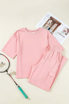 Pink Cloud 2-piece lounge set featuring a half sleeve tee and cargo sweatpants, ideal for casual outings and lounging.