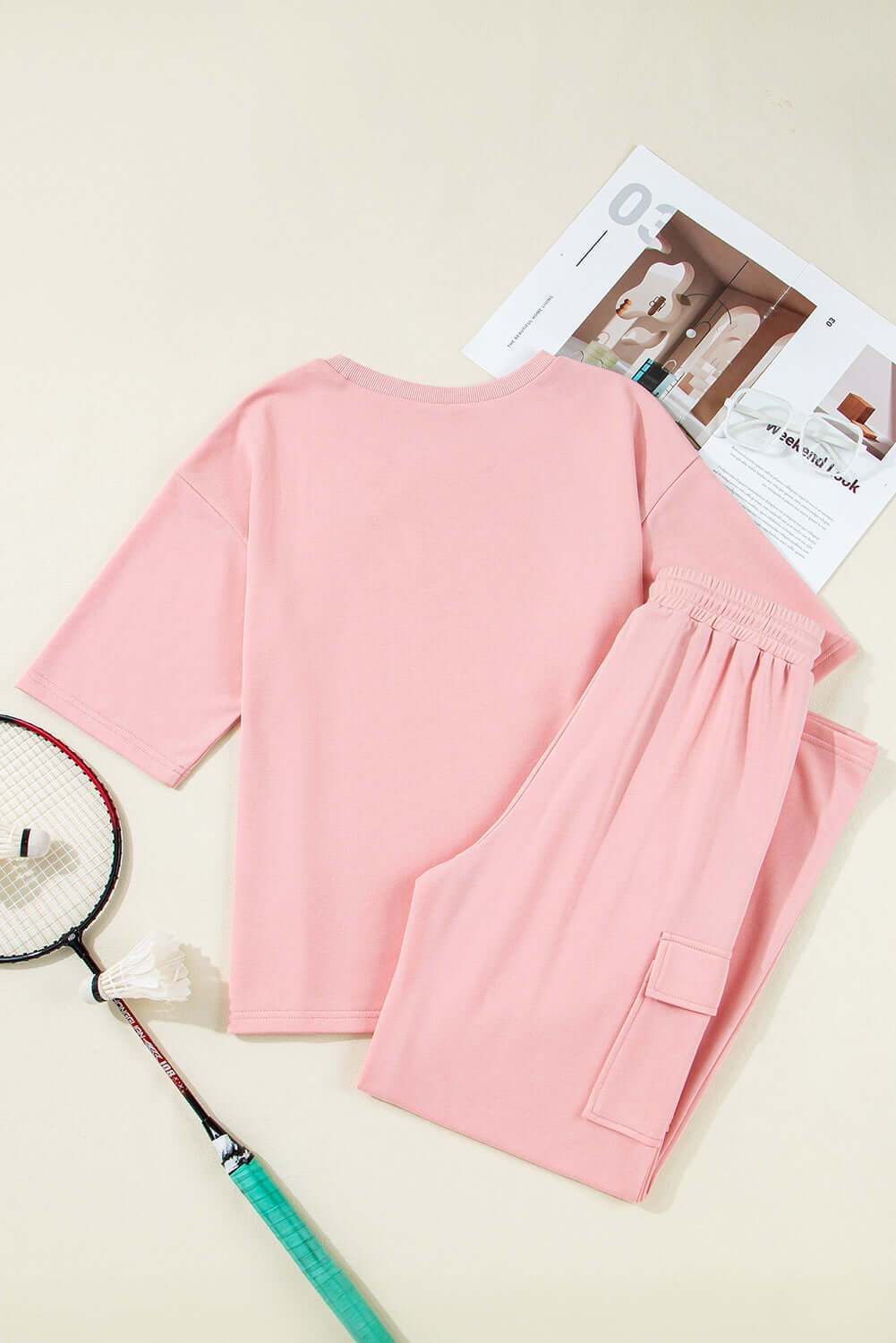 Pink Cloud 2 piece lounge set featuring half sleeve tee and cargo sweatpants in soft pink.