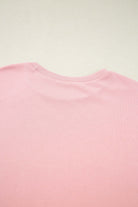 Close-up view of the pink crew neck tee in the Pink Cloud lounge set, emphasizing its soft fabric and color.