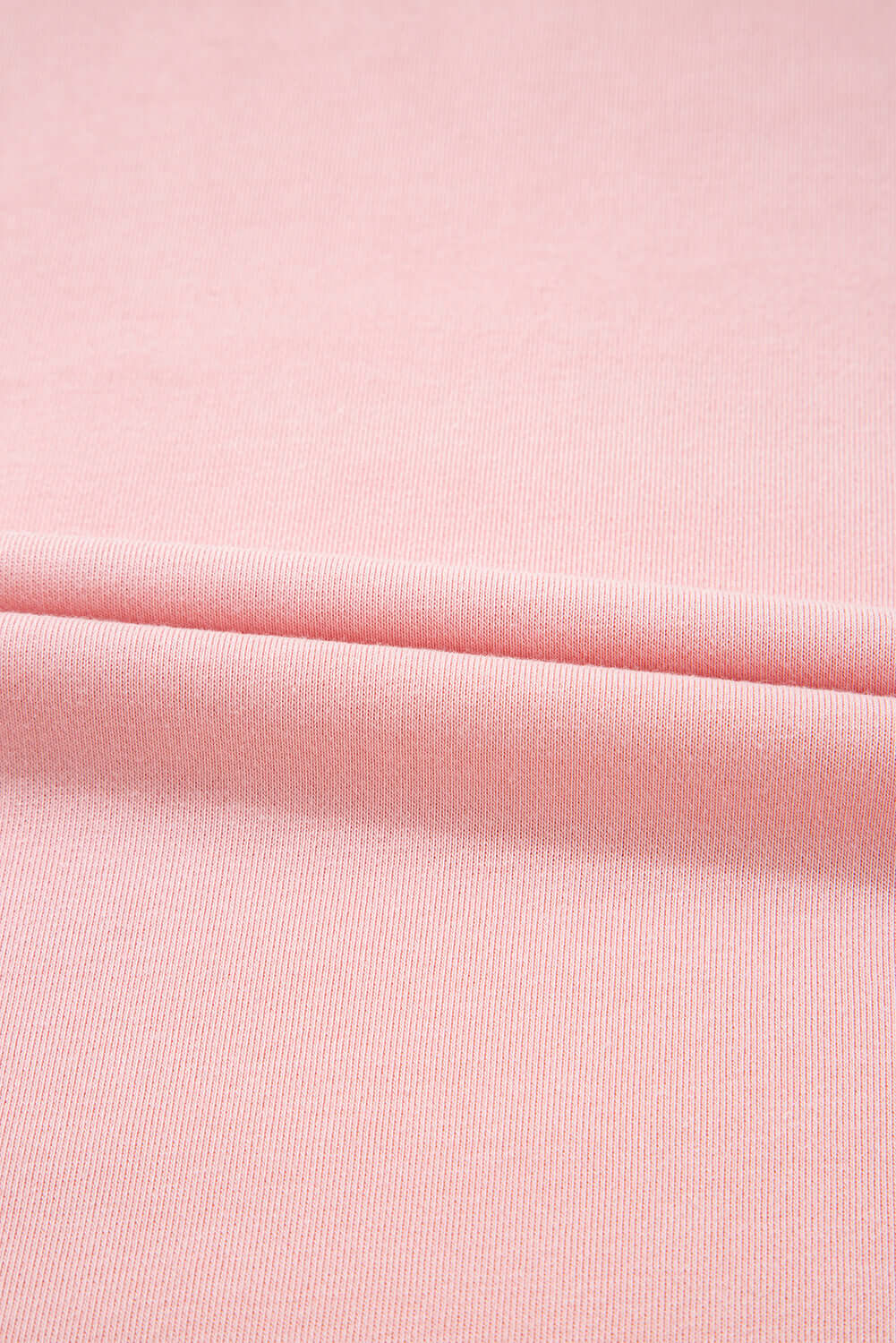 Soft pink fabric texture showcasing the material of the Pink Cloud lounge set.