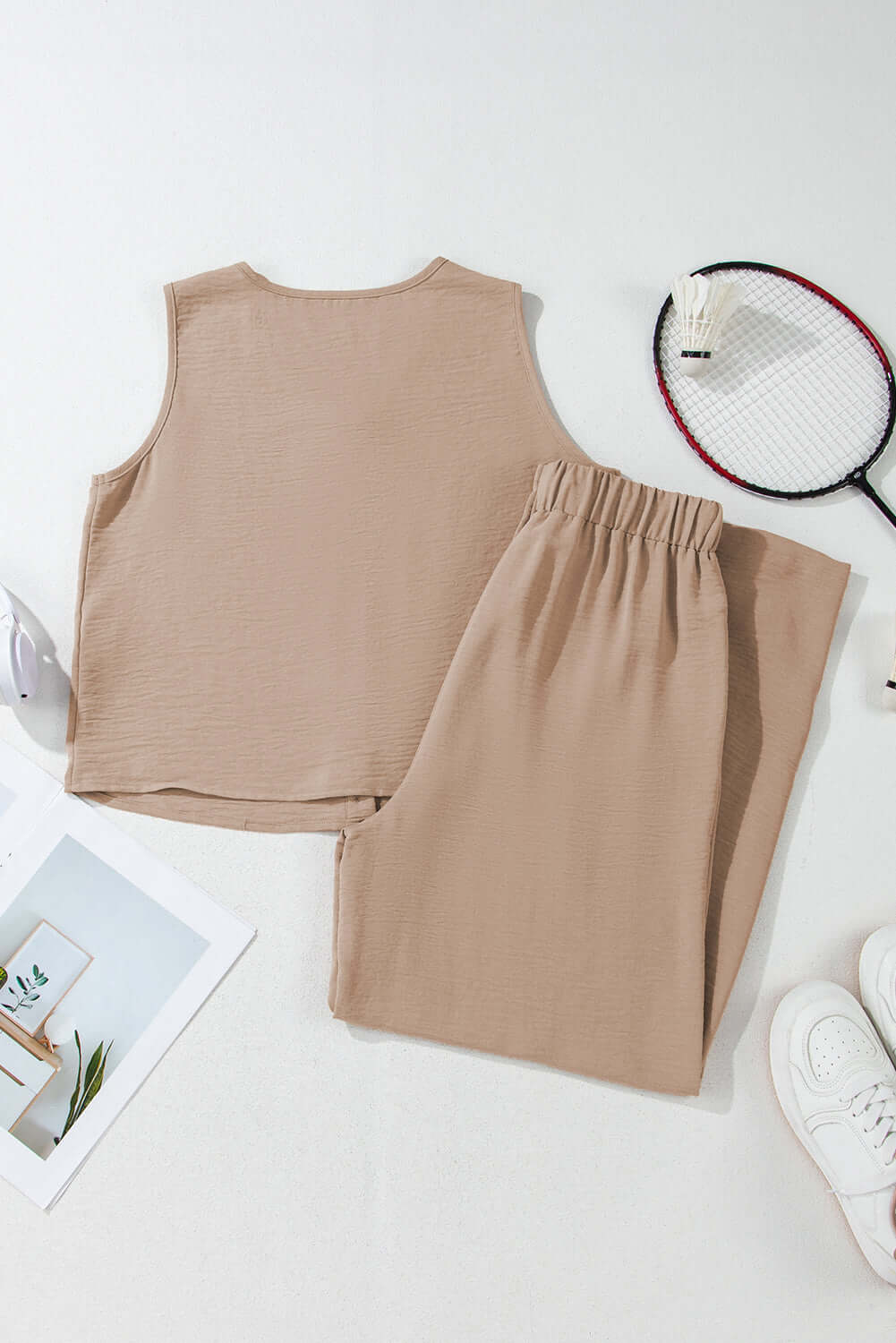 Oasis Moment tan 2-piece pants set featuring a cropped vest and wide-leg pants on a white surface.