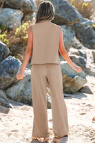Oasis Moment tan 2-piece set with buttoned vest and wide-leg pants, showcased on the beach.