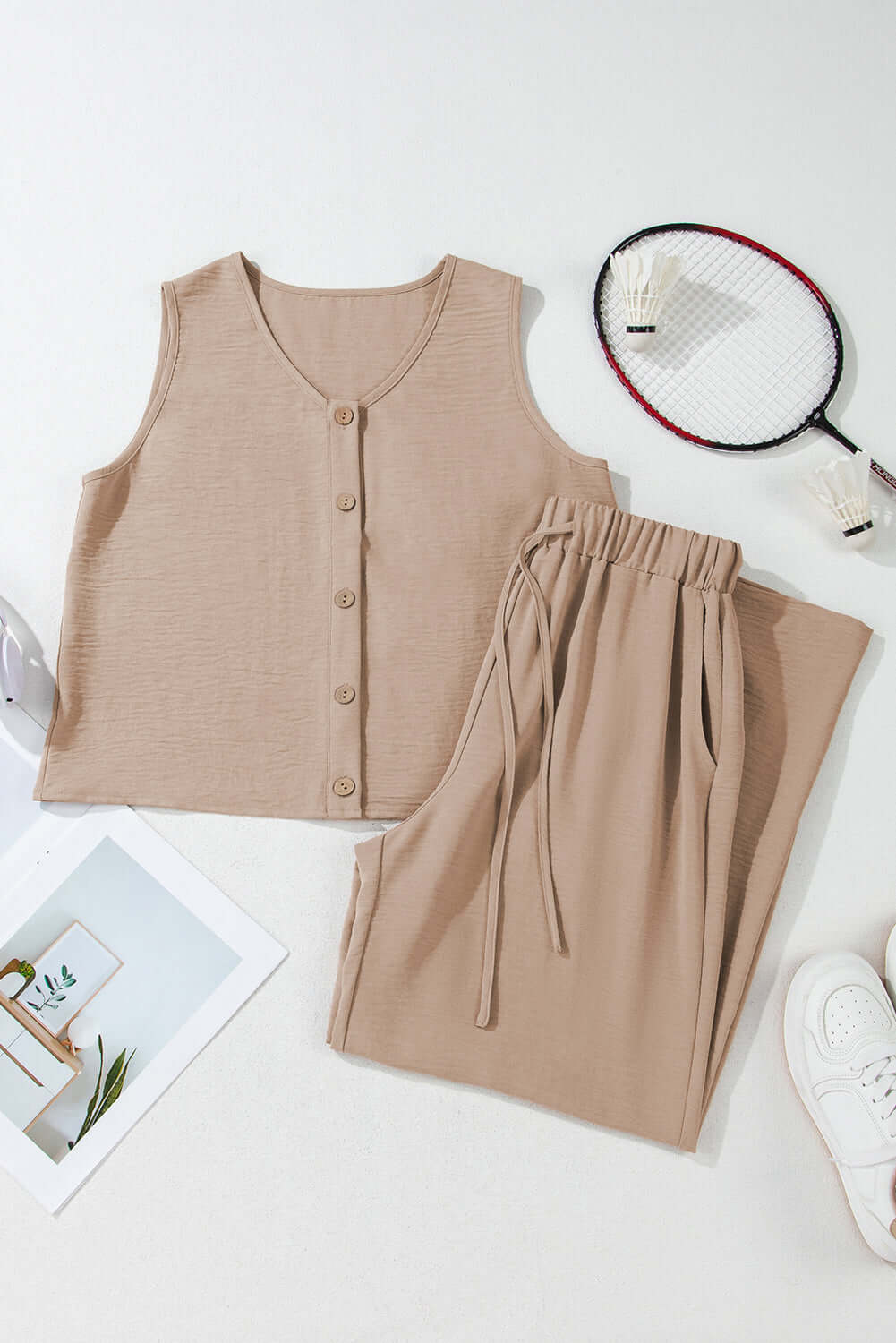 Oasis Moment tan 2-piece pants set featuring a buttoned crop vest and drawstring wide-leg pants laid on a flat surface.