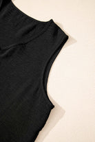 Close-up of black crop vest from Oasis Moment 2-piece pants set, featuring a boxy neckline and sleeveless design.