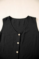 Close-up of a black buttoned crop vest with a v-neckline and five buttons, part of the Oasis Moment pants set.