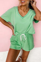 Bright green Zest for Life shorts set featuring a V-neck tee and adjustable drawstring shorts, perfect for warm weather.