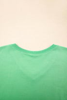 Back view of a bright green V-neck tee from the Zest for Life shorts set for summer styling.
