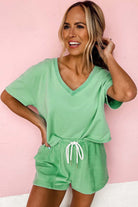 Bright green Zest for Life shorts set with V-neck tee and drawstring shorts, perfect for warm-weather styling.