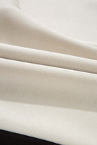 Close-up of soft, cream-colored fabric showcasing texture for the METRO MODE SHORTS SET.