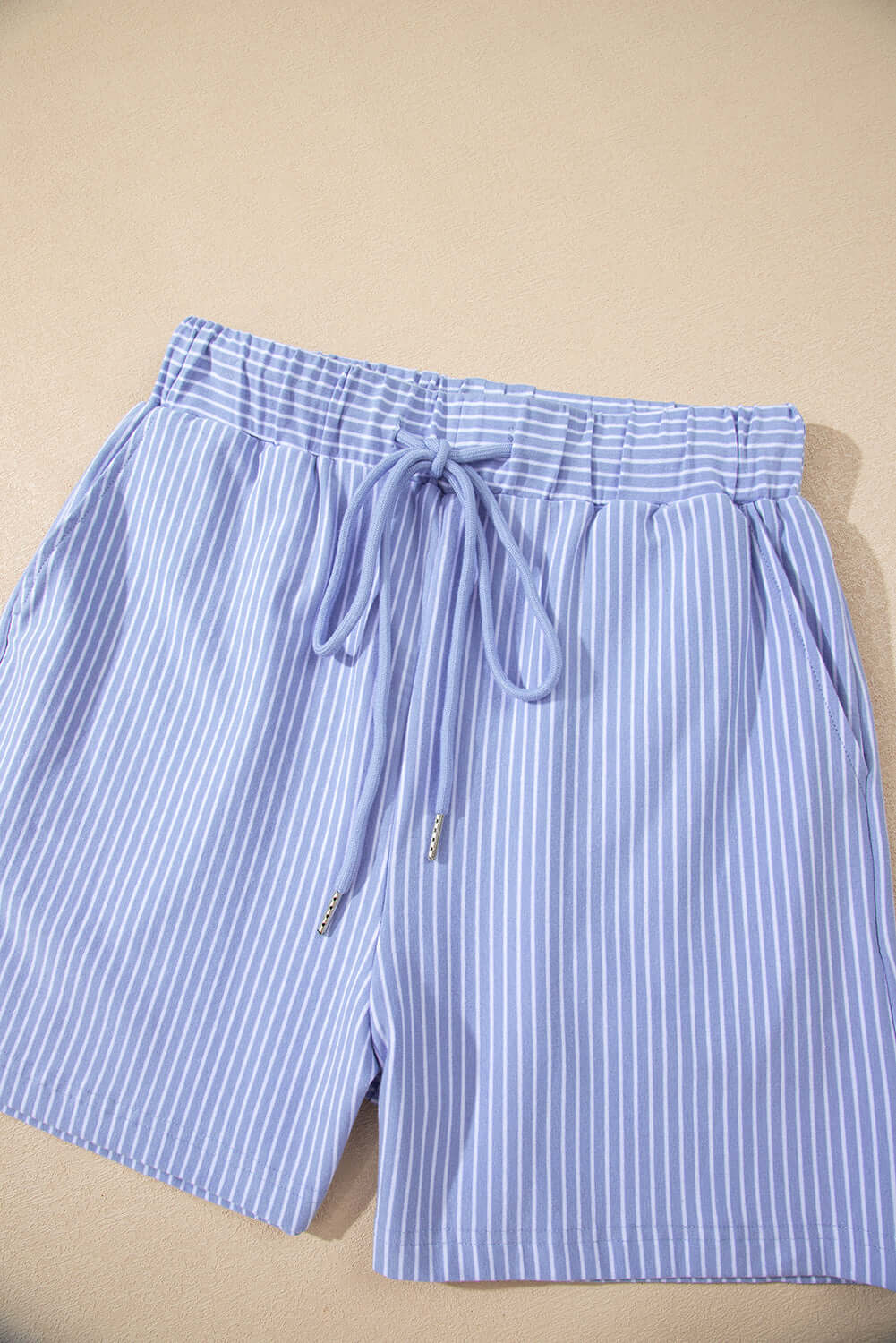Sky blue striped drawstring shorts from Misty Harbor's 2-piece set, perfect for casual summer outings.