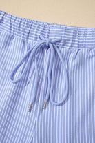 Close-up of Misty Harbor shorts featuring a drawstring and blue vertical stripes, perfect for casual summer wear.