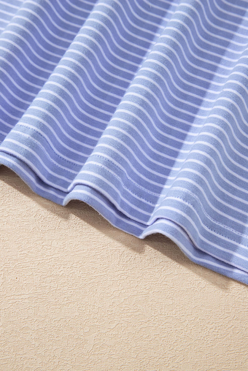 Sky blue and white striped fabric showcasing smooth texture and nautical style, ideal for the Misty Harbor shorts set.