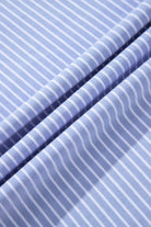 Close-up of sky blue striped fabric, showcasing soft texture and nautical-inspired pattern for stylish apparel.