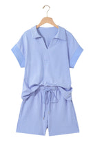 Misty Harbor 2-piece shorts set featuring sky blue stripes, dolman sleeve polo top, and drawstring shorts.