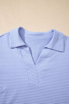 Close-up of Misty Harbor sky blue polo top with vertical stripes and a classic collar, perfect for casual outfits.