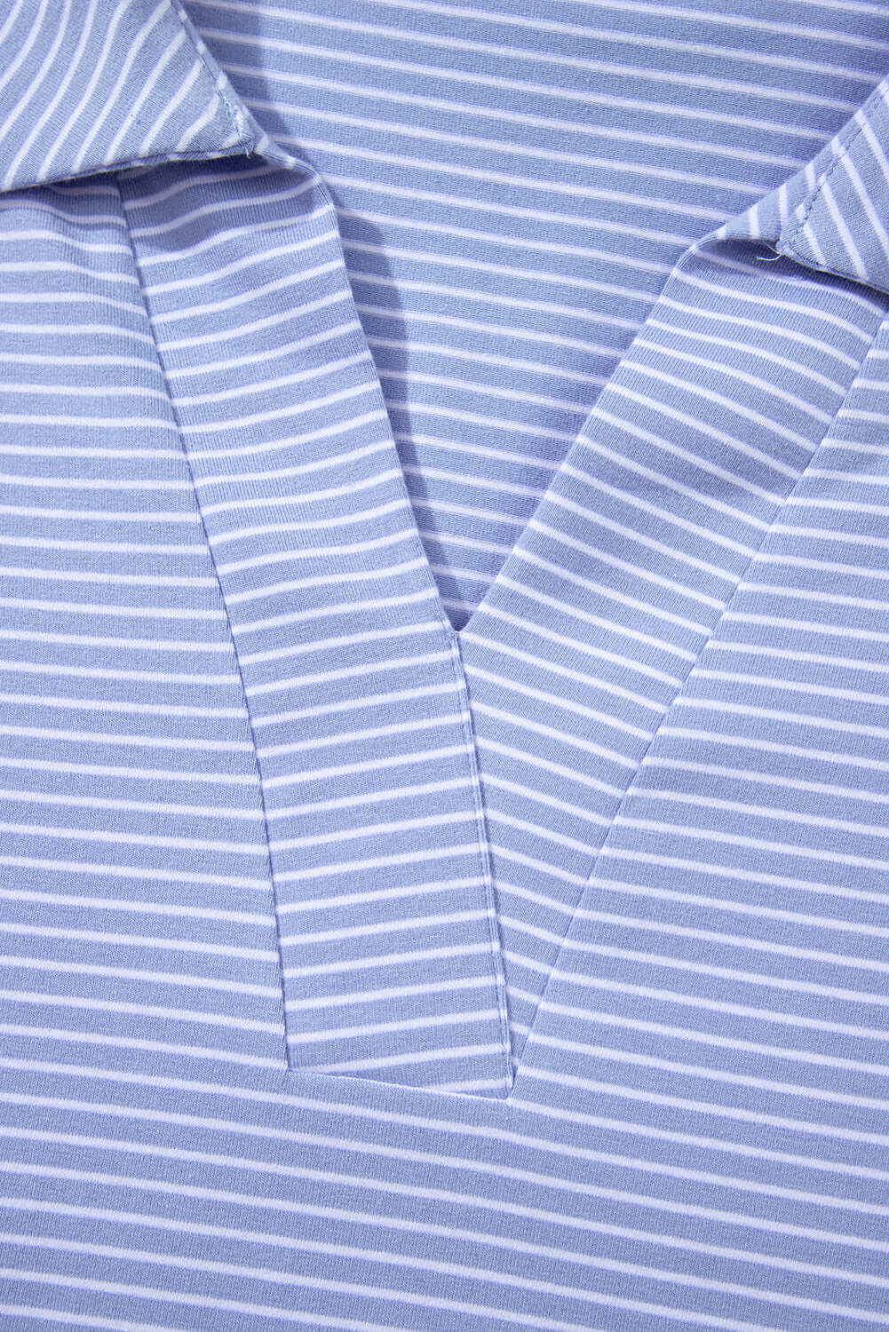 Close-up of V-neck, striped polo top from Misty Harbor 2-piece shorts set in sky blue.