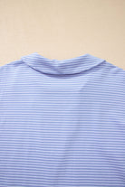 Back view of Misty Harbor blue stripe polo top, featuring a classic collar and soft fabric.