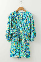 Colorful green and blue abstract print Wave Dancer Romper with puff sleeves and V-neckline, perfect for summer.