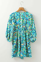 Wave Dancer Romper back view with green and blue abstract print, puff sleeves, and flattering fit.