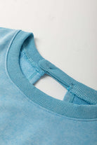 Close-up of the sky blue Chill Factor Romper's neckline featuring a playful hollow-out detail.