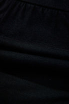 Close-up of black fabric featuring ruching, ideal for the Eclipse Edge Skort's comfortable design.