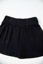 Eclipse Edge Skort in black, featuring a wide waistband and ruched design for stylish comfort.