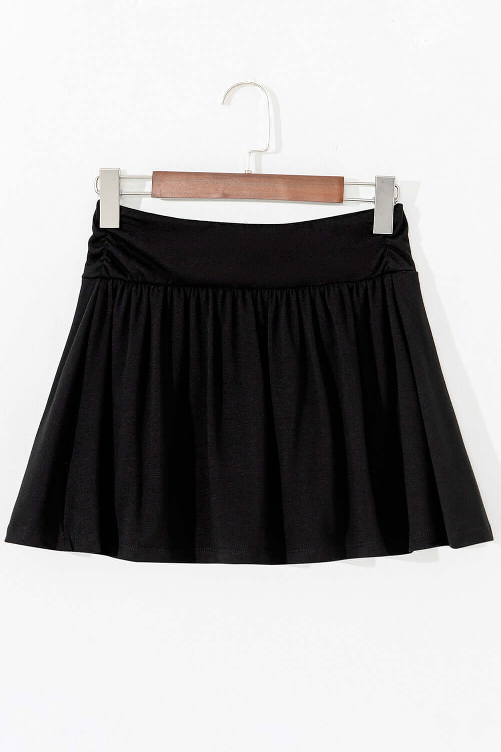 Black Eclipse Edge skort with wide waistband and ruched detail, ideal for activewear and everyday comfort.