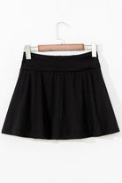 Eclipse Edge Skort featuring a flattering black wide waistband and ruched design for stylish activewear.