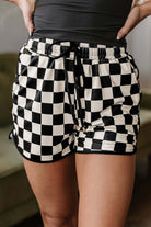 Fast Lane black and white checkered drawstring shorts for casual and stylish wear.