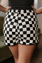 Back view of black and white checkered Fast Lane Shorts with drawstring waistband.