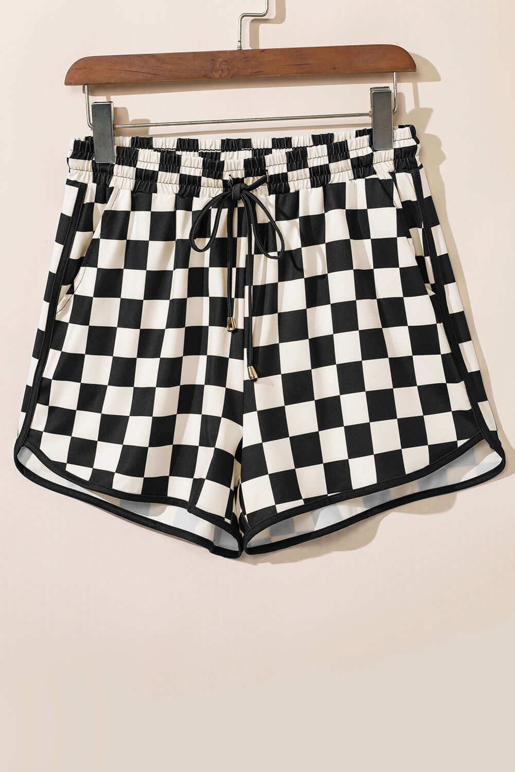 Fast Lane Shorts in black and white checkered pattern, featuring a drawstring and casual design.